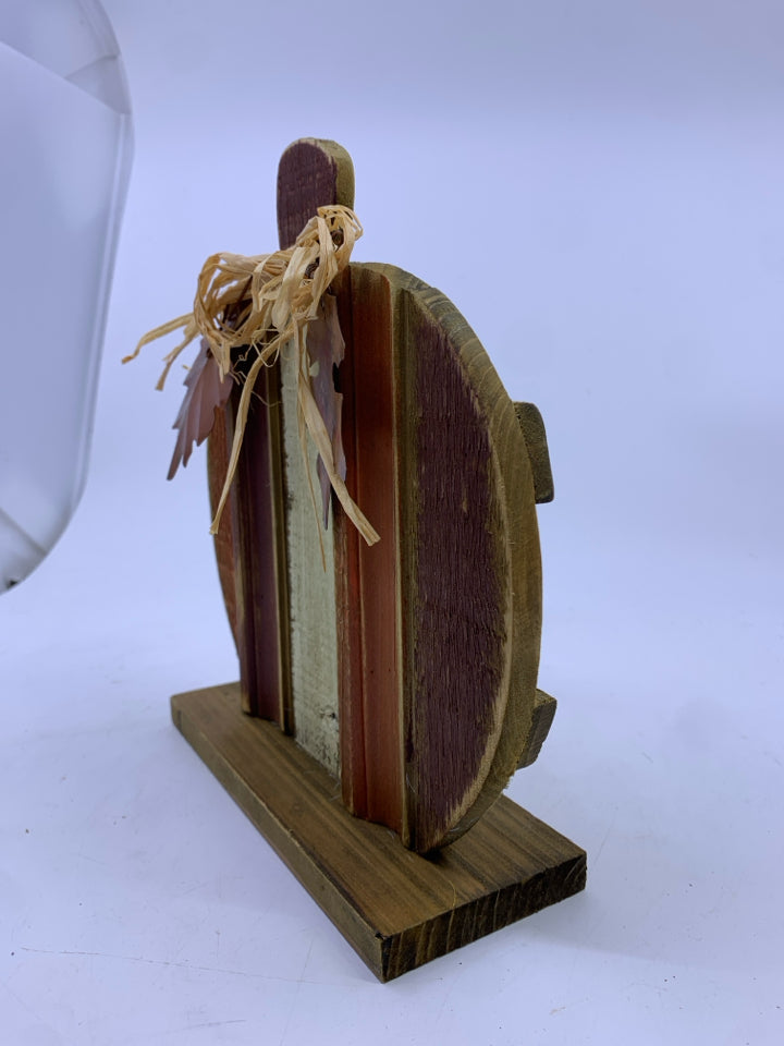 WOOD PUMPKIN W/ METAL LEAVES RED/ORANGE/CREAM ON STAND.