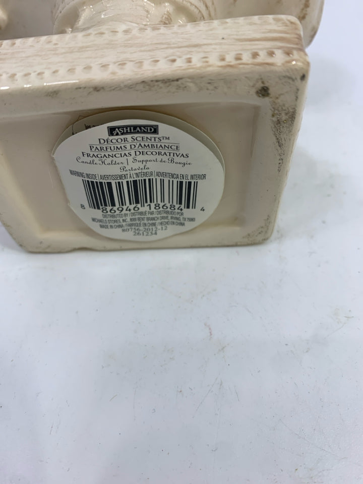 FLEUR-DE-LIS CERAMIC TEA-LIGHT HOLDER.