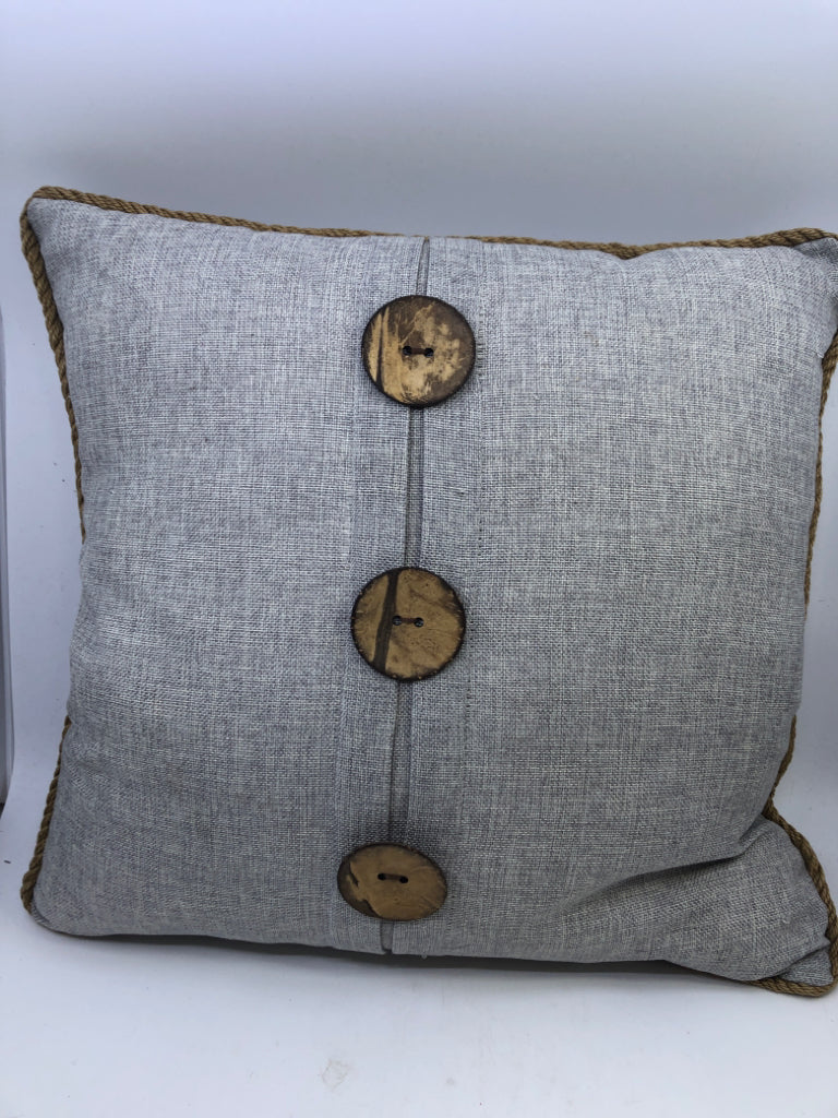 LIGHT GREY SQUARE PILLOW W/ LARGE BUTTONS/ROPE TRIM.
