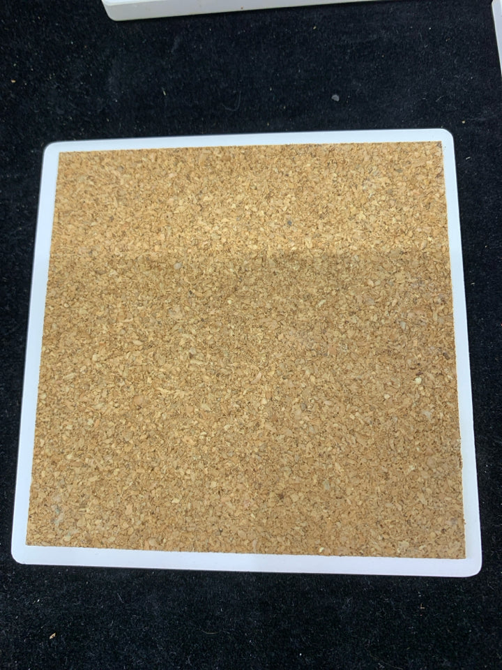 4 NIB WINE BOTTLES STONE COASTERS IN STAND.