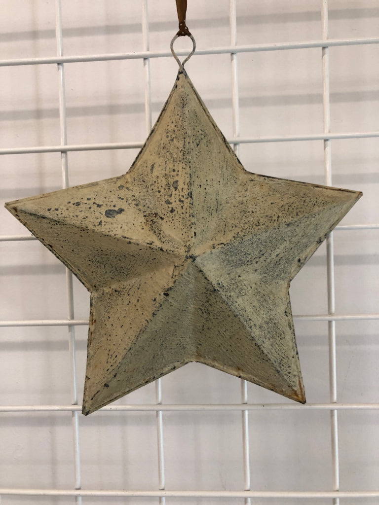 TAN WASHED METAL STAR HANGING.
