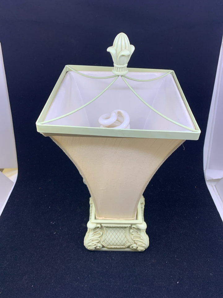 SCROLL BASE LAMP WITH CREAM FLARED TOP SHADE.