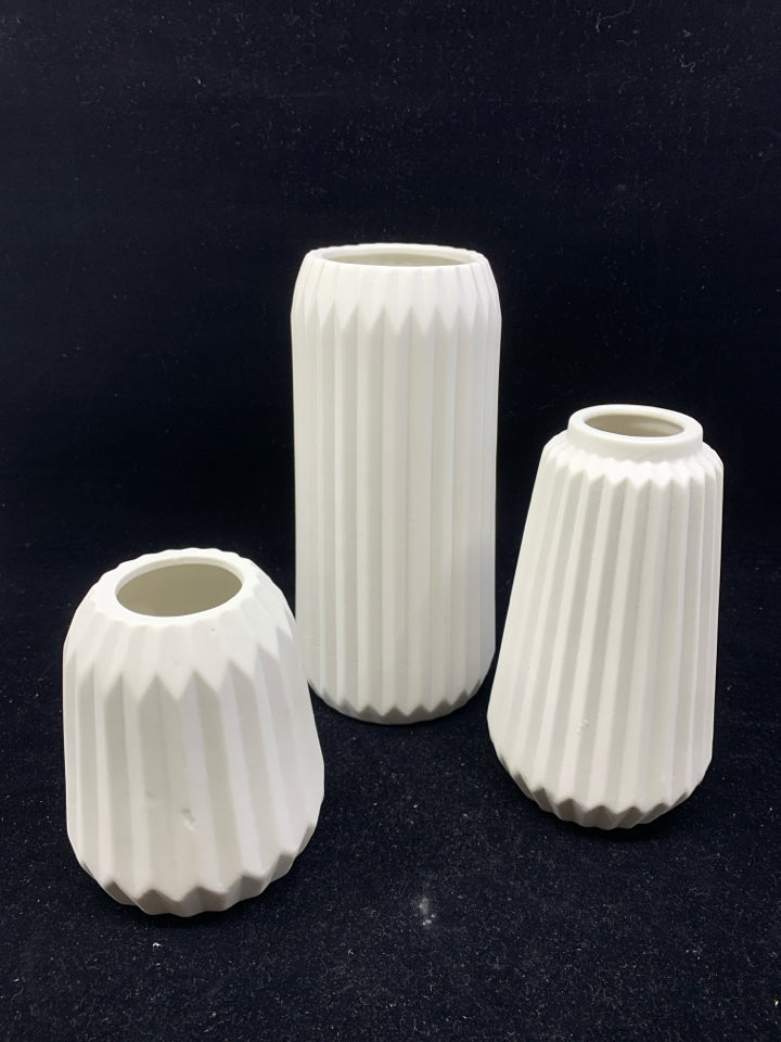 3 CERAMIC RIBBED VASES.