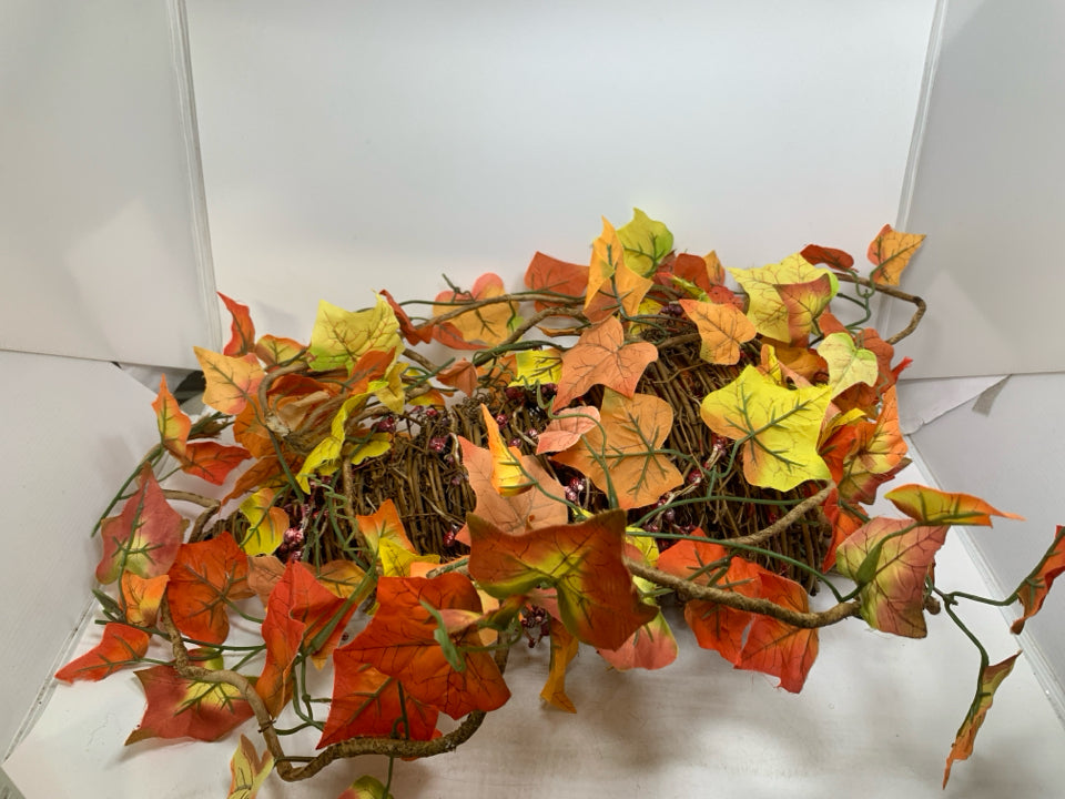 STICK WOVEN HANGING BASKET W/ FAUX FALL LEAVES HANGING.