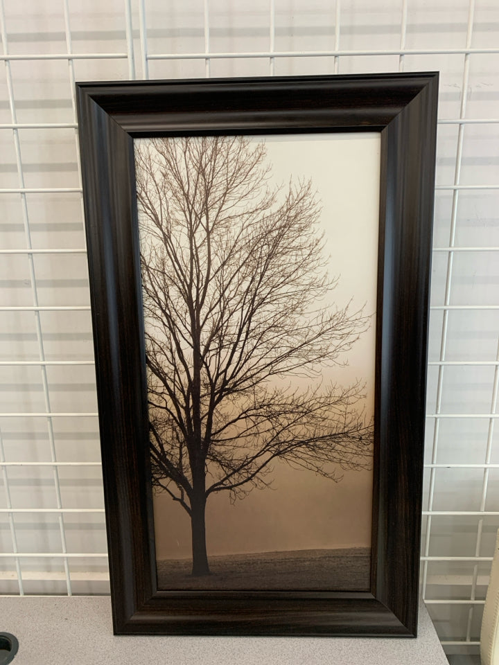 BARE TREE SILHOUETTE IN BROWN WOOD FRAME.