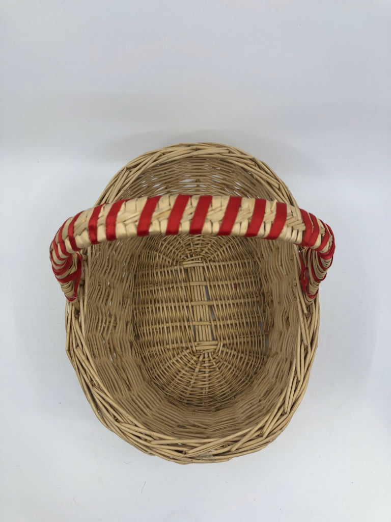 BLONDE WICKER BASKET W/HANDLE AND RED RIBBON.