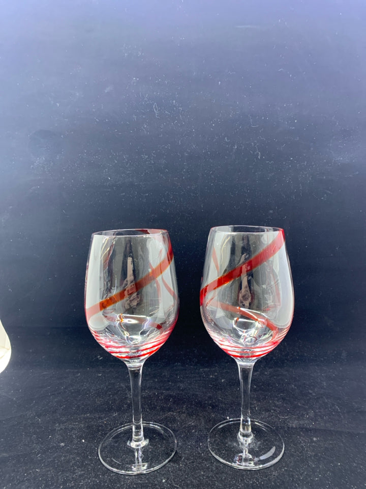 2 LARGE WINE GLASSES W RED SWIRL.