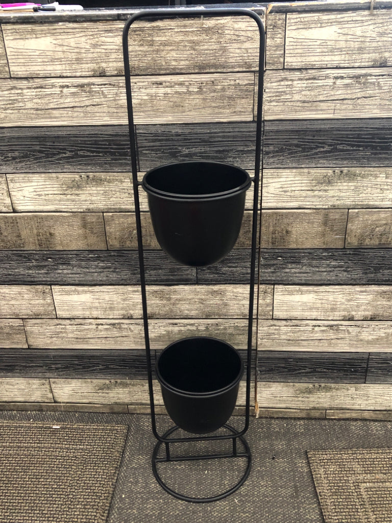 MINIMALIST BLACK METAL TIERED PLANT STAND.