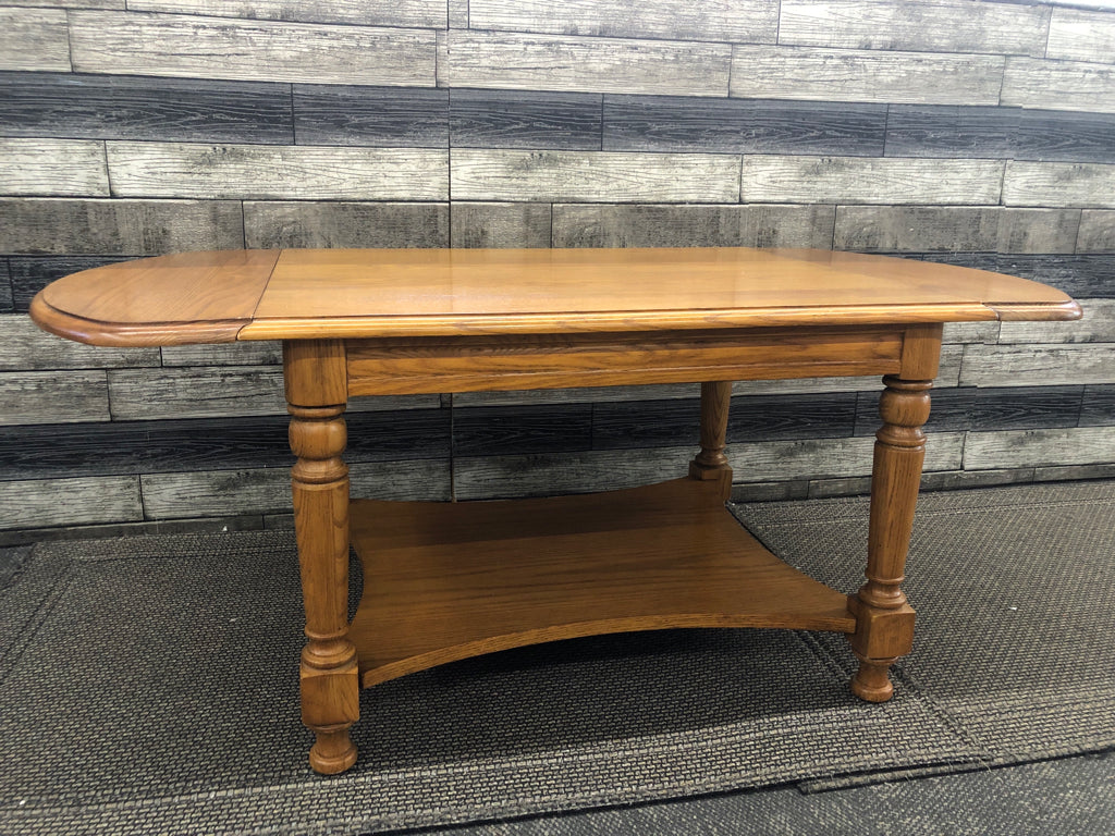 SOLID WOOD 2 TIER COFFEE TABLE W/ 2 DROP LEAF ENDS.
