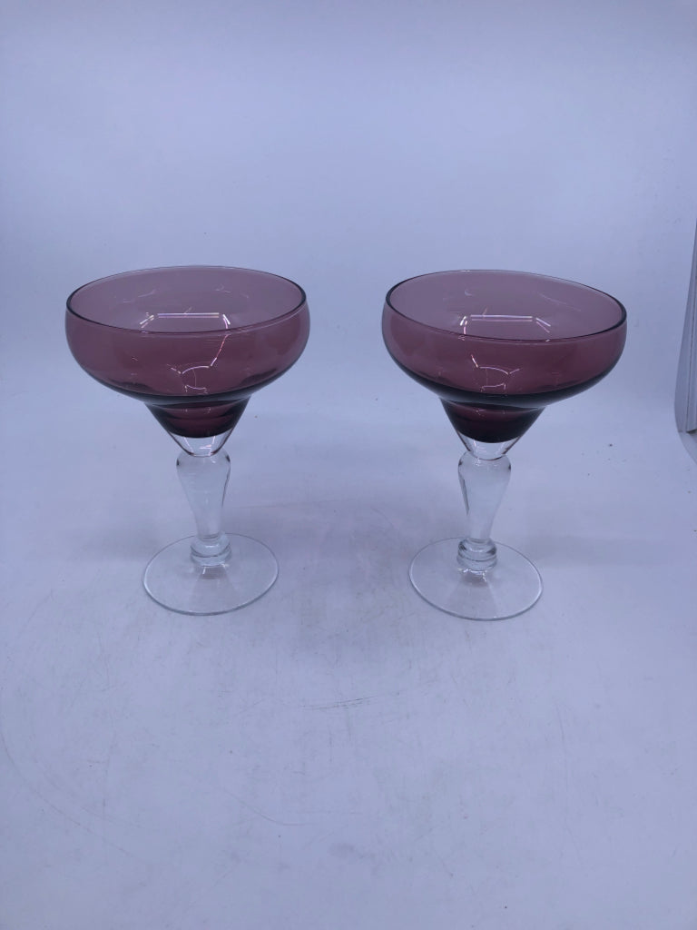 2 PURPLE GLASS MARGARITA GLASSES W/ CLEAR STEMS.