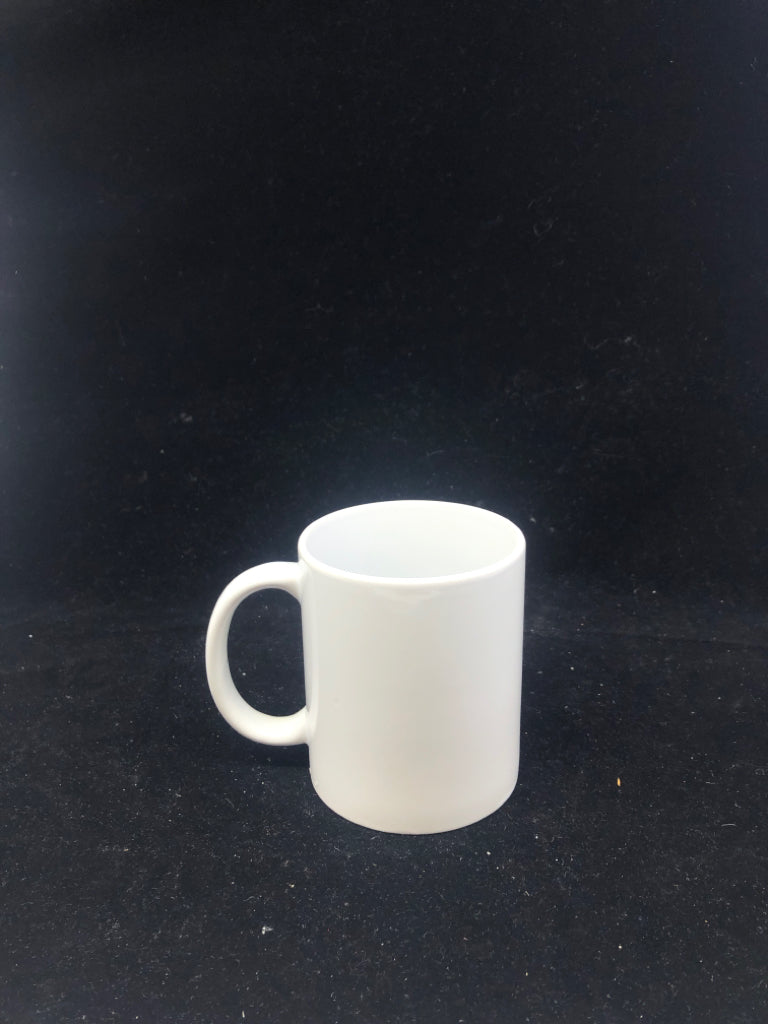 WHITE CERAMIC MUG.