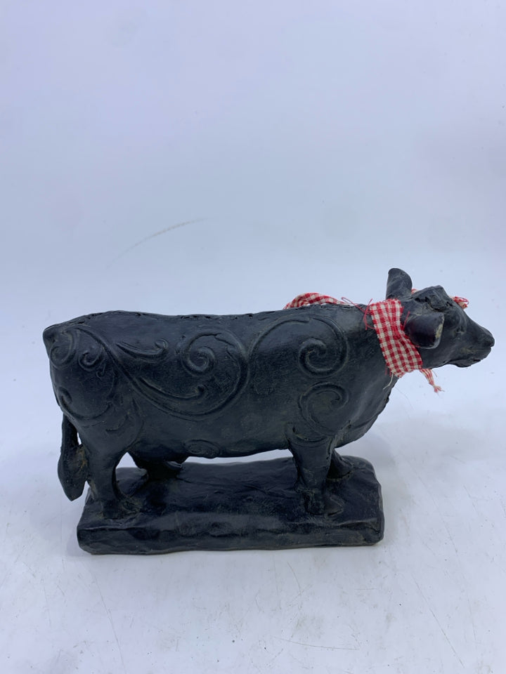 BLACK STANDING COW W/ SWIRL DESIGN.
