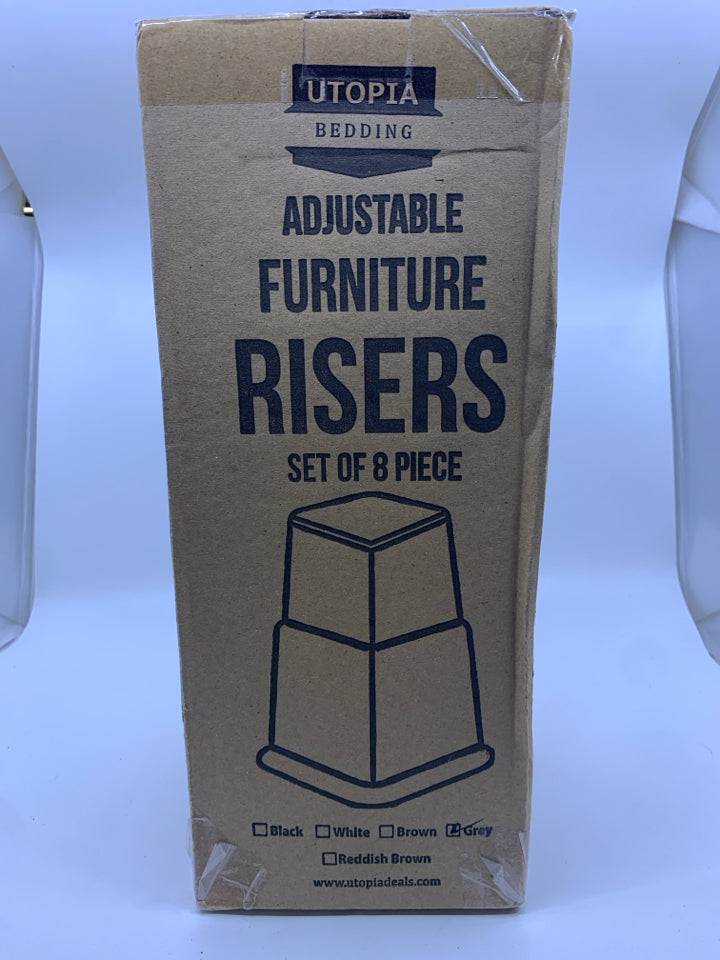 NIB FURNITURE RISERS.