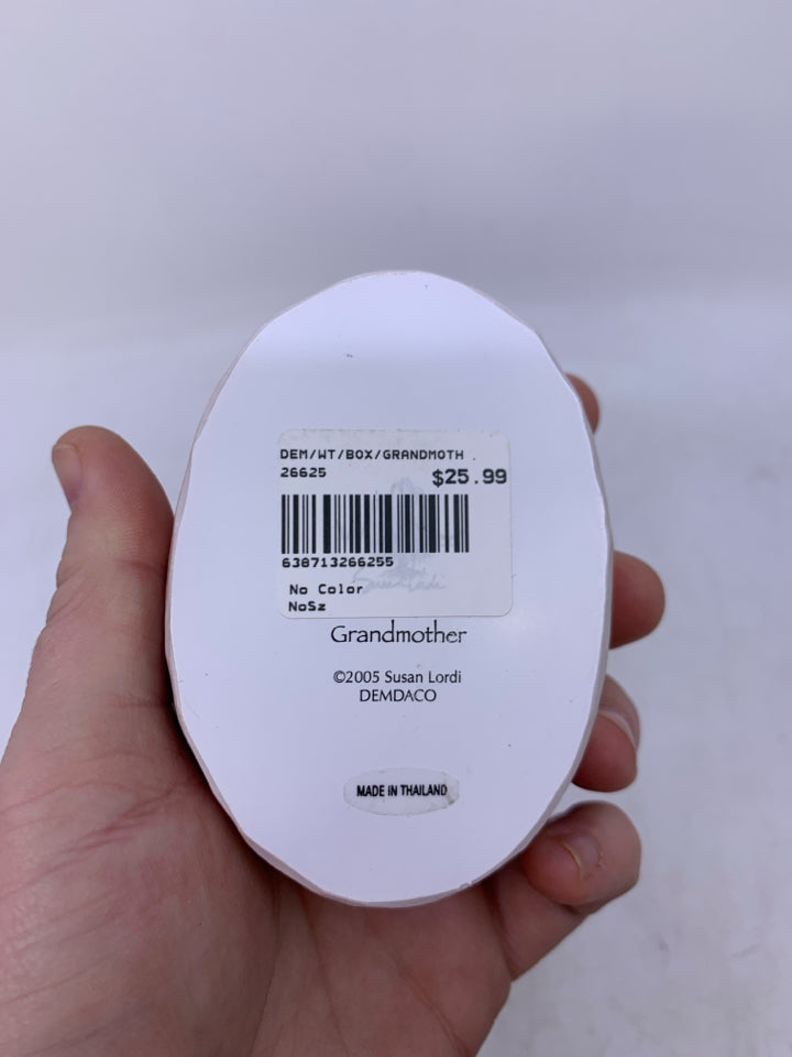 SMALL OVAL GRANDMOTHER HOLDING BABY.