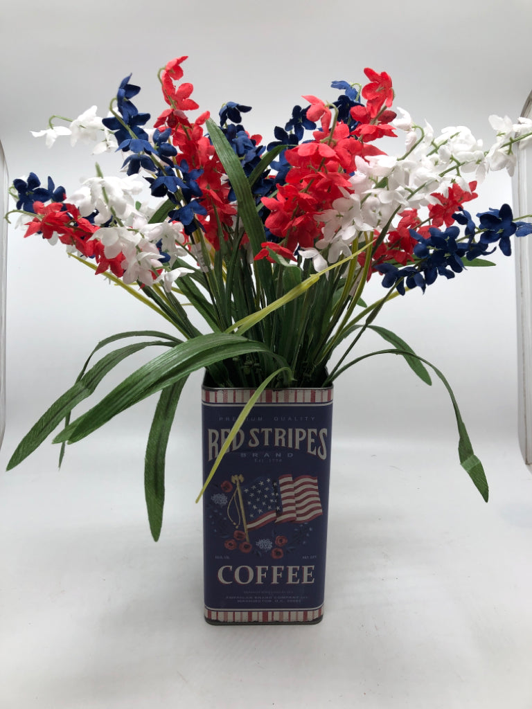 AMERICANA TIN W/ RED,WHITE,BLUE FAUX FLOWERS.