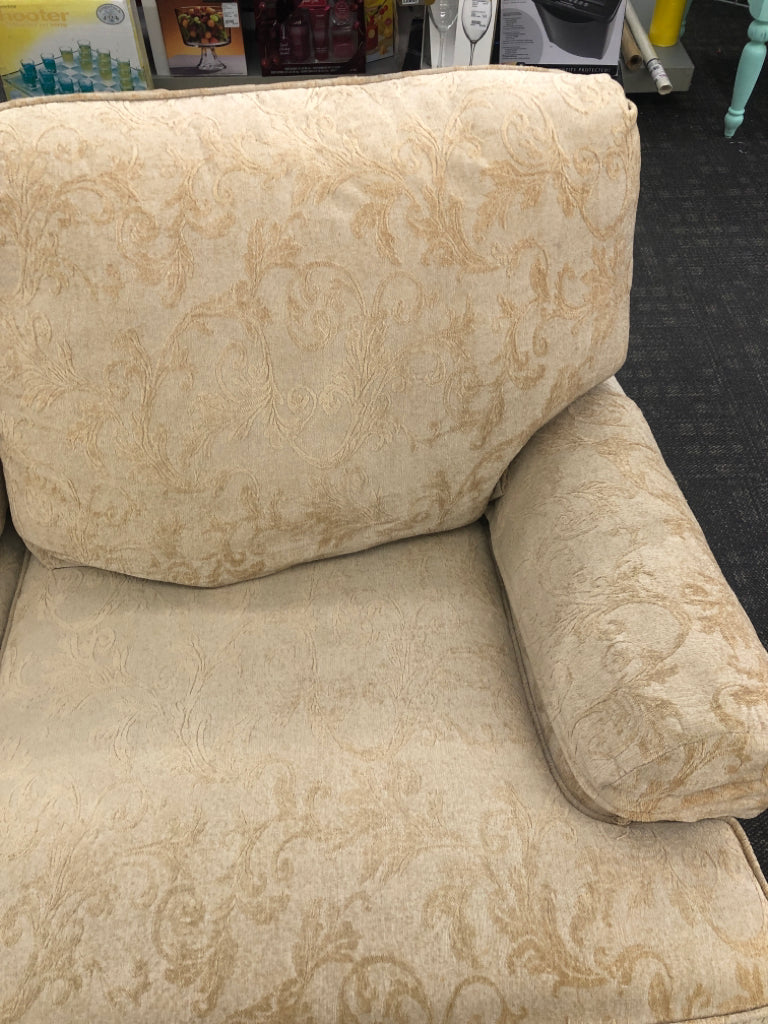 CREAM VELVET SOFA W/ EMBOSSED SCROLL DESIGN.