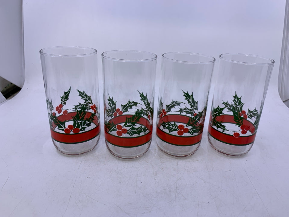 4 CLEAR GLASSES W/ MISTLETOE PRINTED ON BOTTOM.