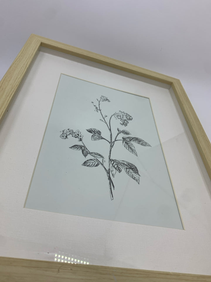 PALE BLUE FLORAL PRINT IN WOOD FRAME.