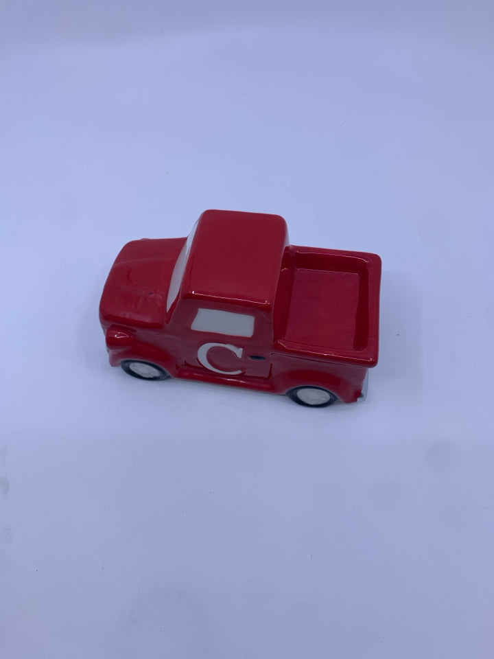 SMALL CERAMIC RED TRUCK W/ "C" ON IT.