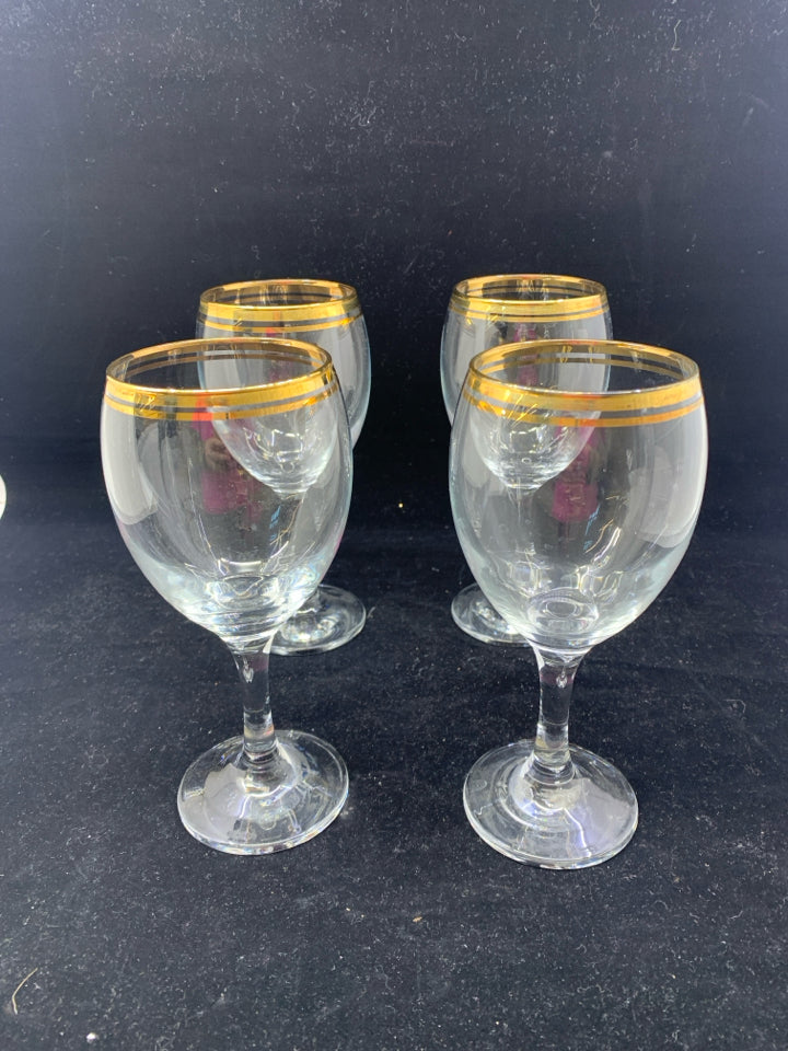 4 GOLD RIMMED WINE GLASSES.