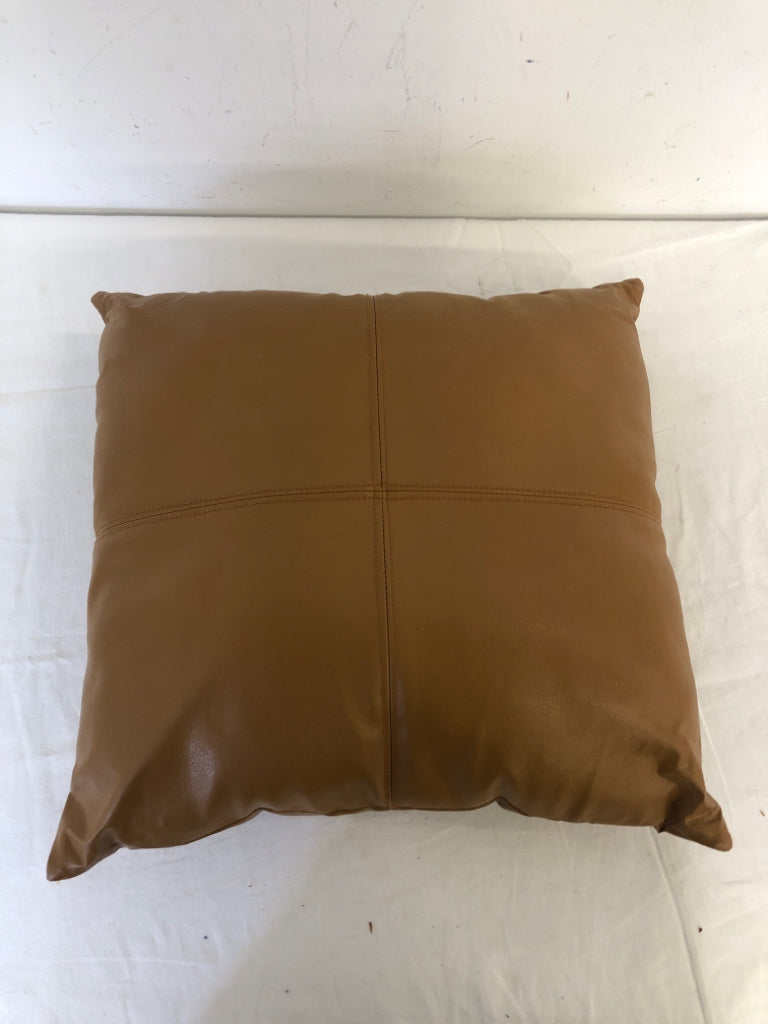 SMALL TAN FAUX LEATHER PILLOW.