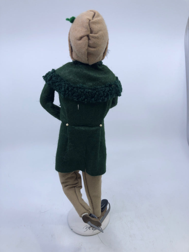 MAN IN GREEN COAT W/ SKATES "THE SKATERS" 1991 BRYERS CHOICE.