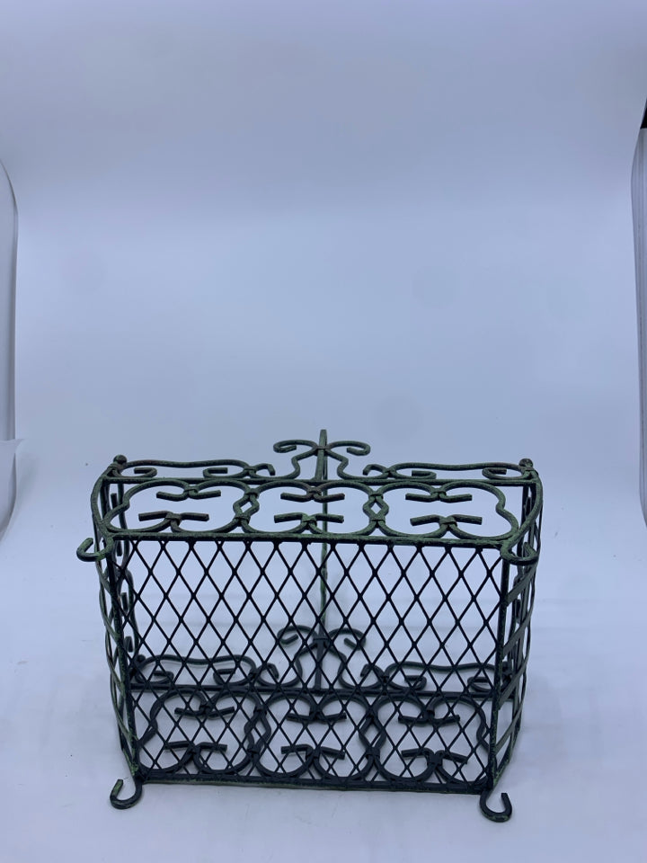 DISTRESSED FOOTED METAL BASKET W/ GREEN TINT SCROLL DESIGN.