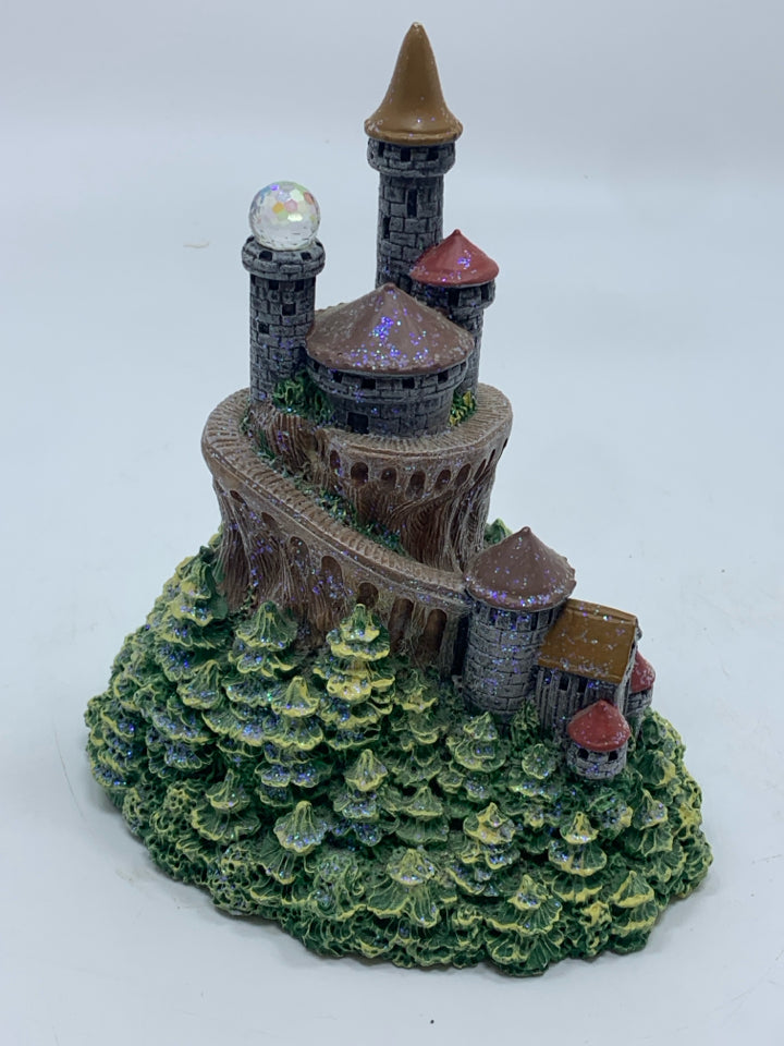 CASTLE WITH CRYSTAL BALL FIGURINE.