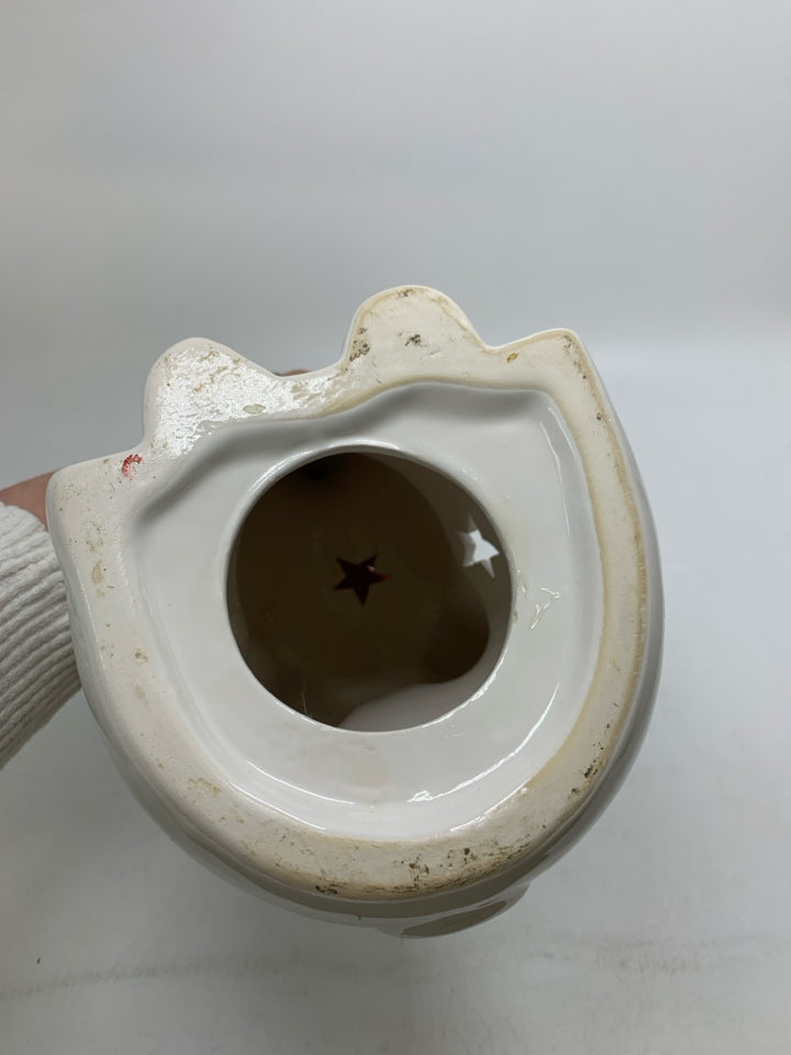 WHITE CERAMIC SITTING ELEPHANT W/ PIERCED STARS.