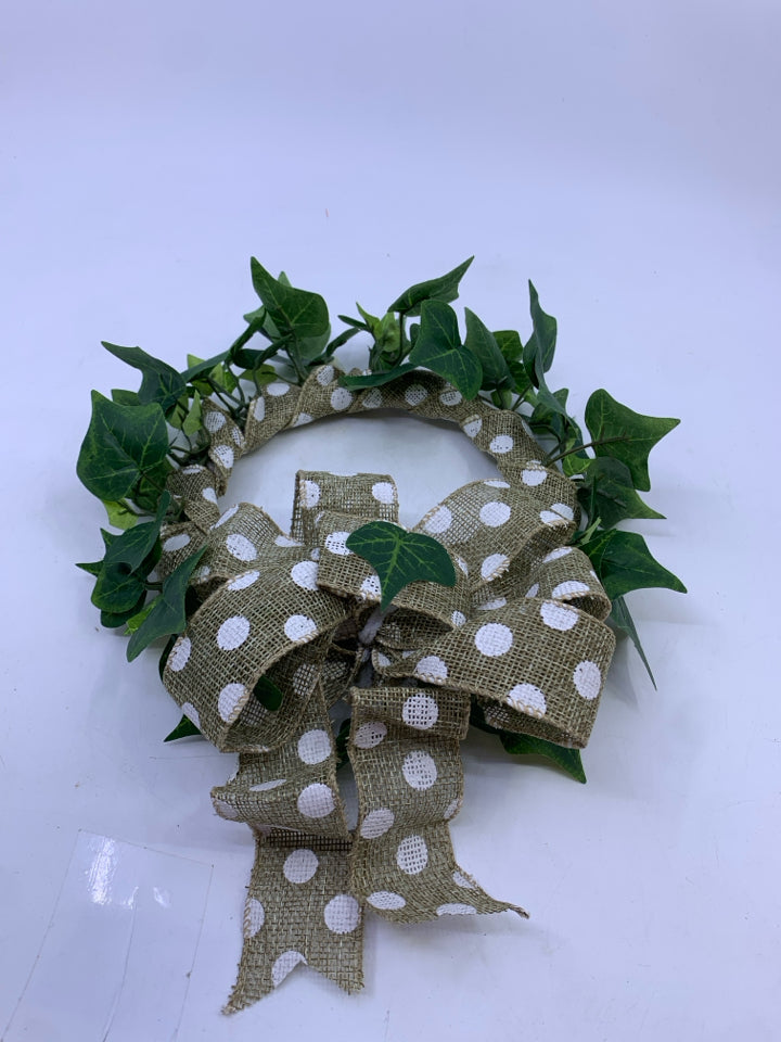 GREEN IVY WREATH WITH POLKA DOT RIBBON.