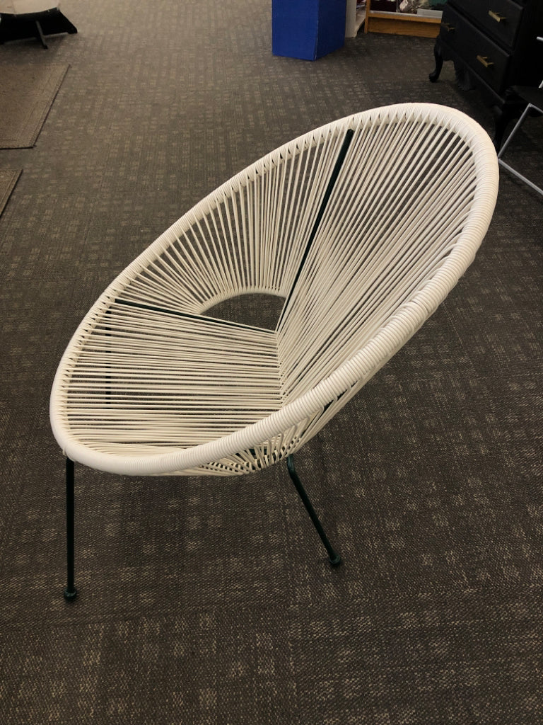 WOVEN PLASTIC EGG-SHAPED CHAIR W/GREEN LEGS.