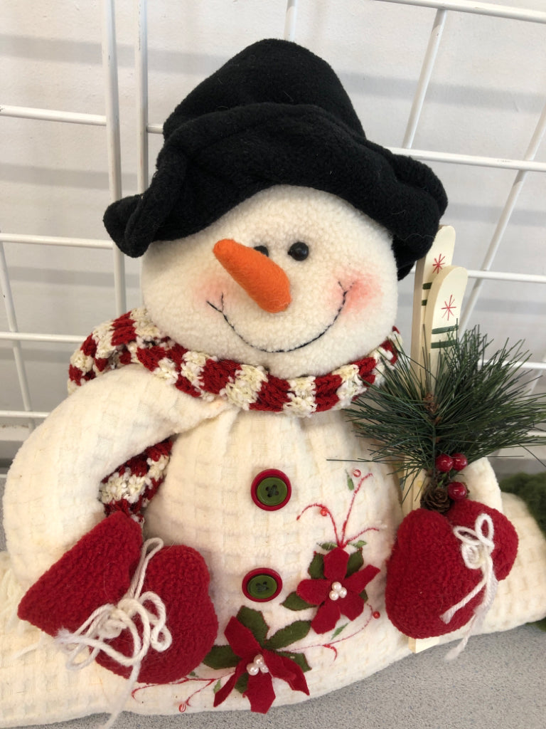 SNOWMAN DOING SPLIT W/ SKIS.