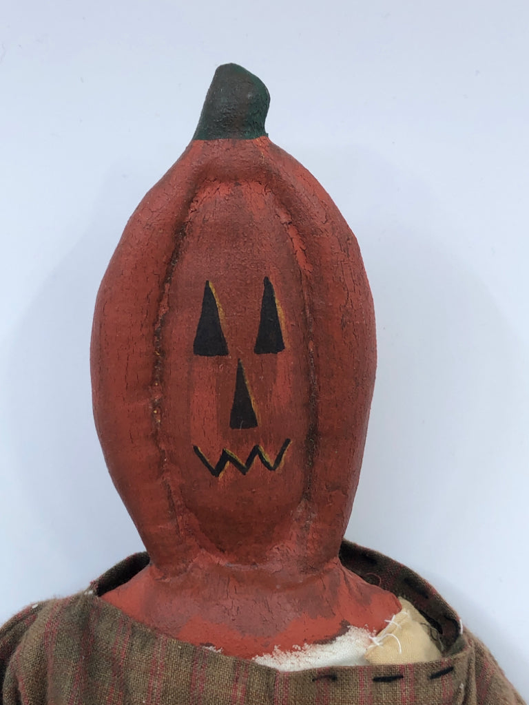 PRIMITIVE PUMPKIN MAN HOLDING BLACK CAT.