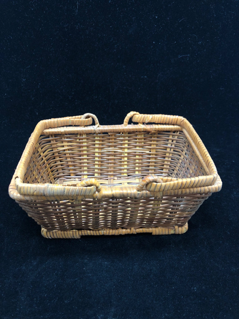 SMALL RECTANGLE BROWN WOVEN BASKET WITH HANDLES.