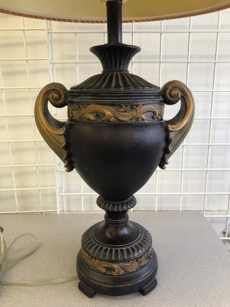BROWN/GOLD LEAF LAMP BASE W/TAN ACCORDION SHADE.