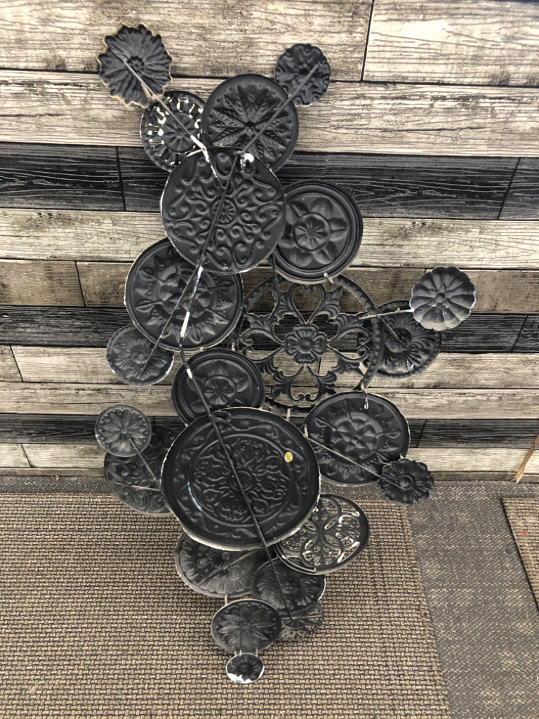 PUNCHED METAL MEDALLIONS WALL HANGING.
