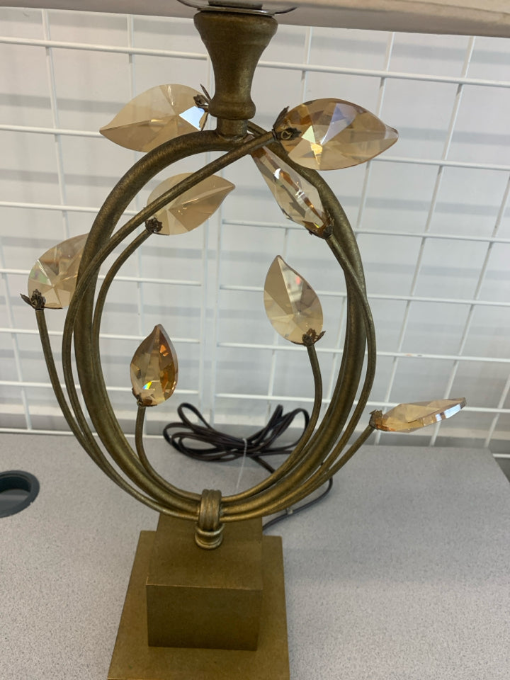 GOLD BASE LAMP W/CRYSTAL LEAVES AND CREAM SHADE.