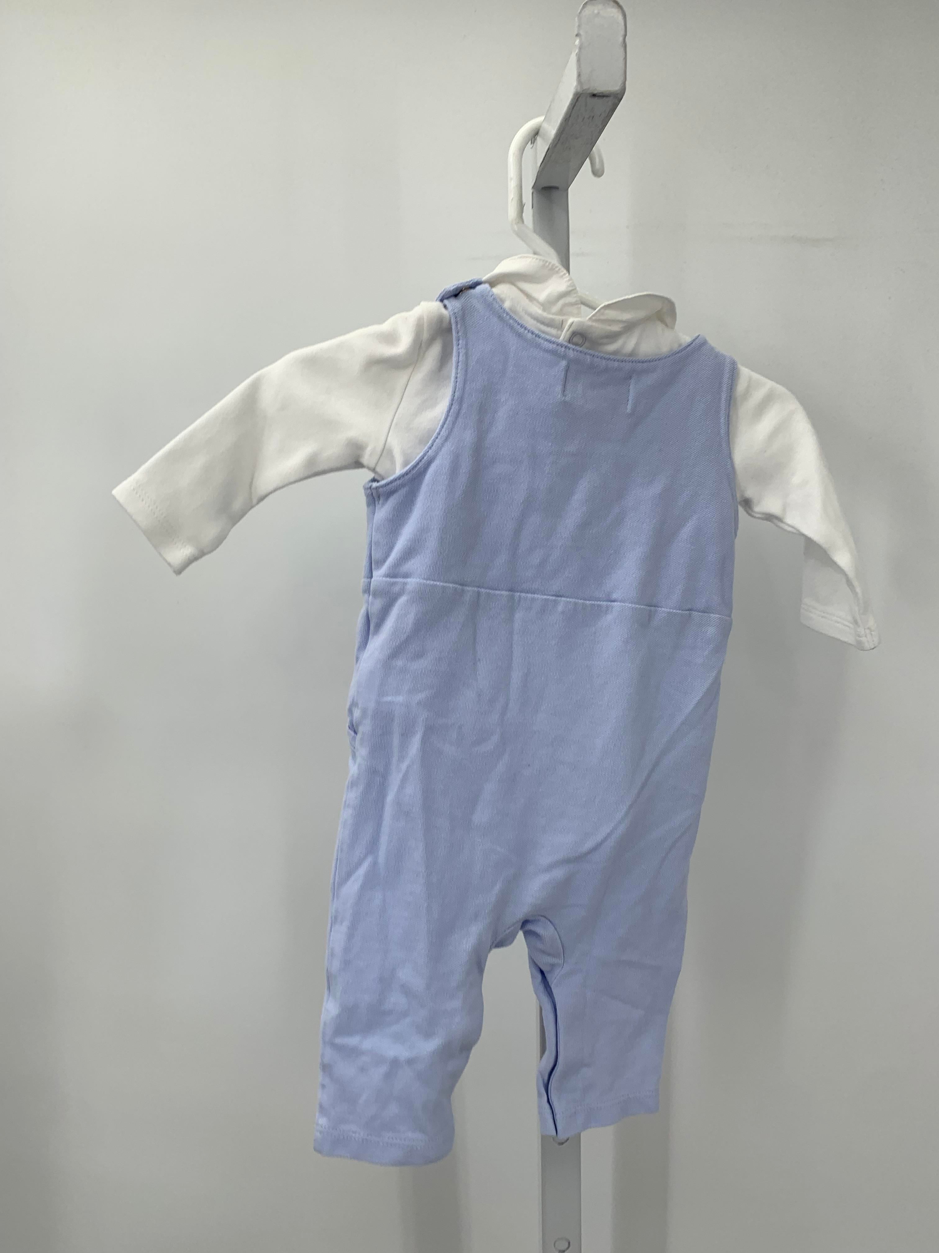 LONG SLV SHIRT AND BLUE OVERALLS.