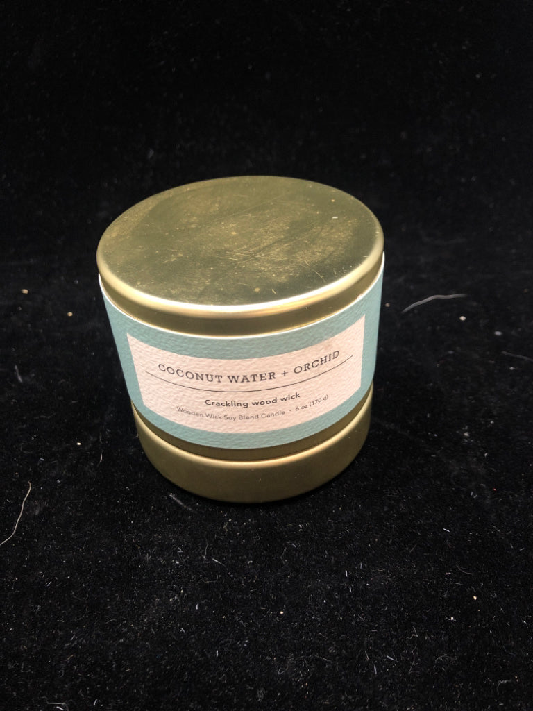 COCONUT WATER AND ORCHID WOOD WICK CANDLE.
