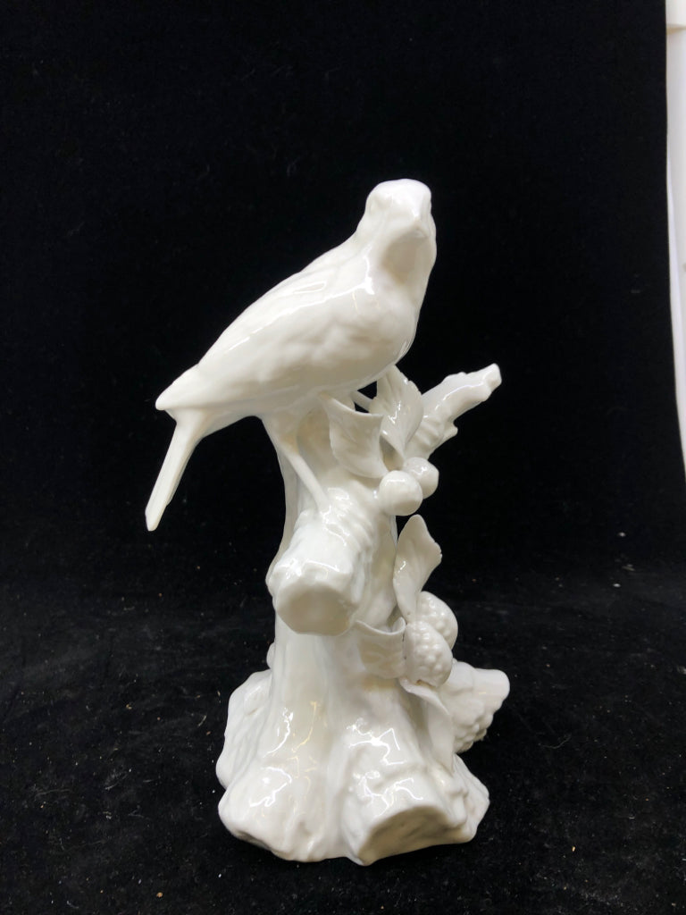 WHITE CERAMIC BIRD ON BRANCH.