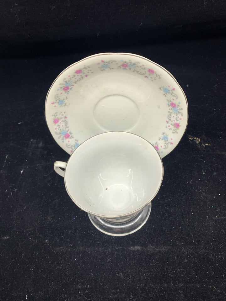 PINK AND BLUE FLORAL TEA CUP AND SAUCER.