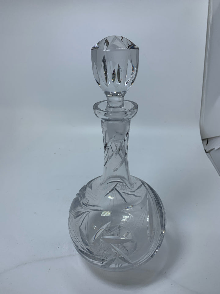 HEAVY CRYSTAL DECANTER W/ ETCHED STAR DESIGNS.