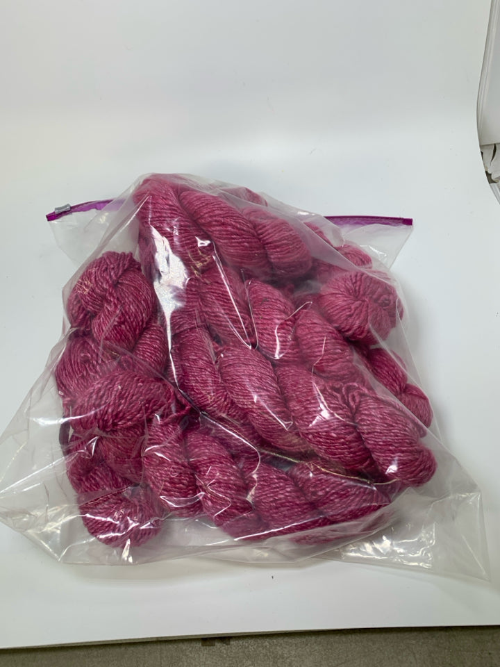 LARGE BAG OF PINK WOOL YARN.