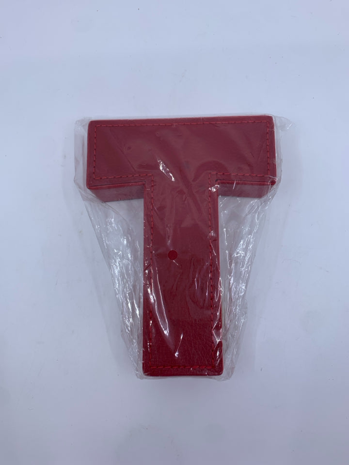 NIP FAUX LEATHER RED "T".