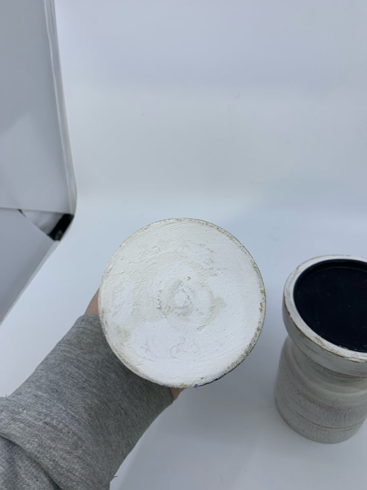 2 PILLAR CANDLE HOLDERS DISTRESSED WHITE.
