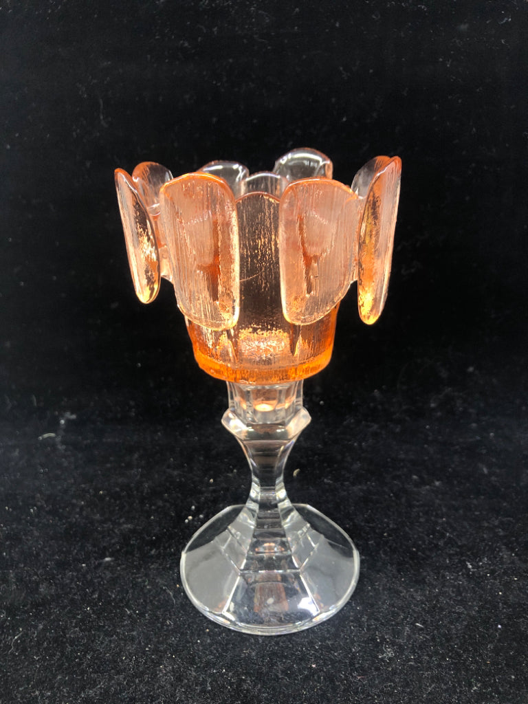 ORANGE PINCHED CANDLE HOLDER.