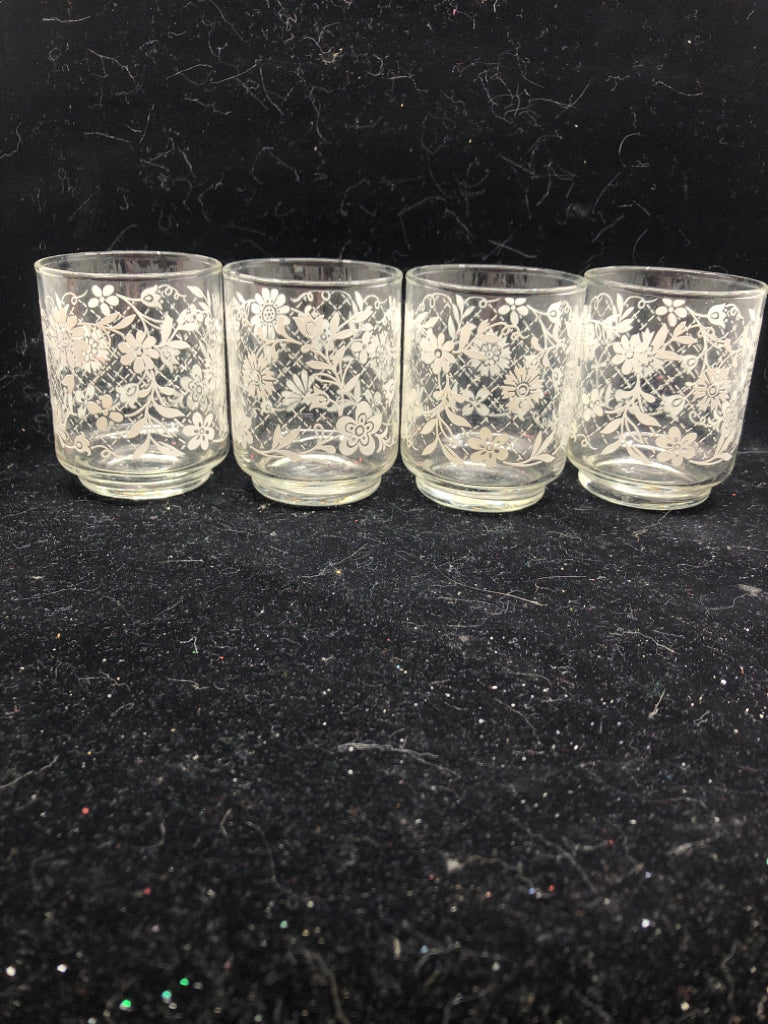 4 WHITE FLORAL JUICE GLASSES.