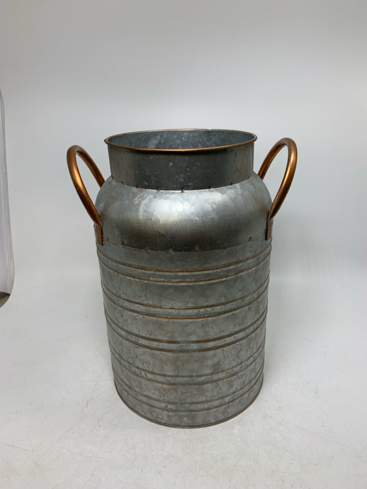 GALVANIZED BUCKET W/ COPPER COLORED DETAILS.