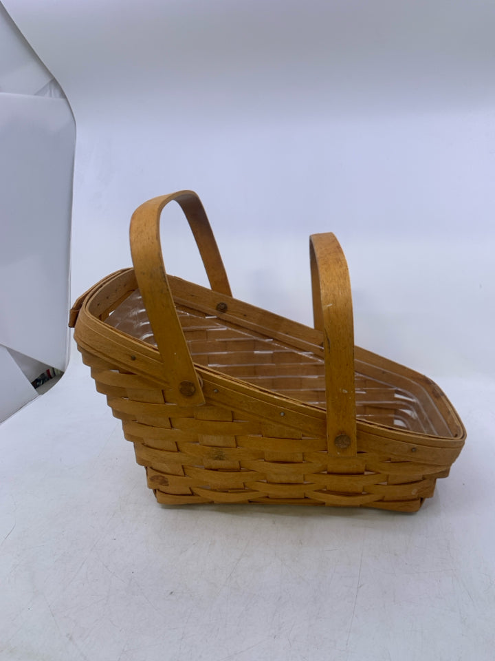 1994 MEDIUM VEGETABLE BASKET W/ HANDLES PLASTIC PROTECTOR.