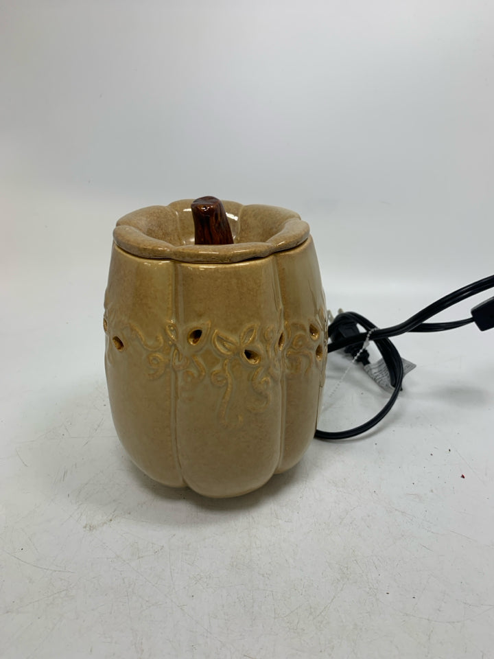 TAN PUMPKIN SHAPED PIERCED TART WARMER.